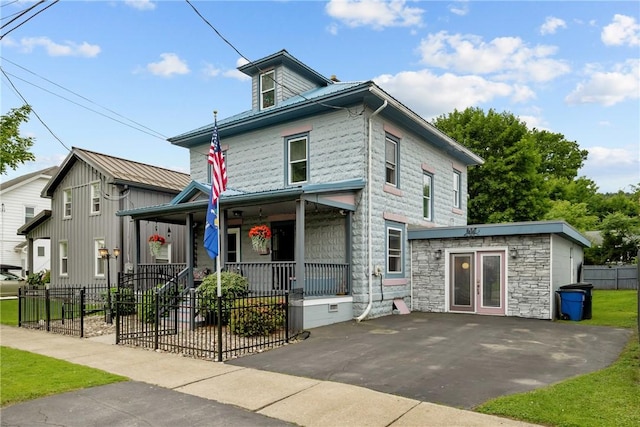 703 N Perry St, Dix, NY 14891 - american foursquare style home featuring a porch and stone siding