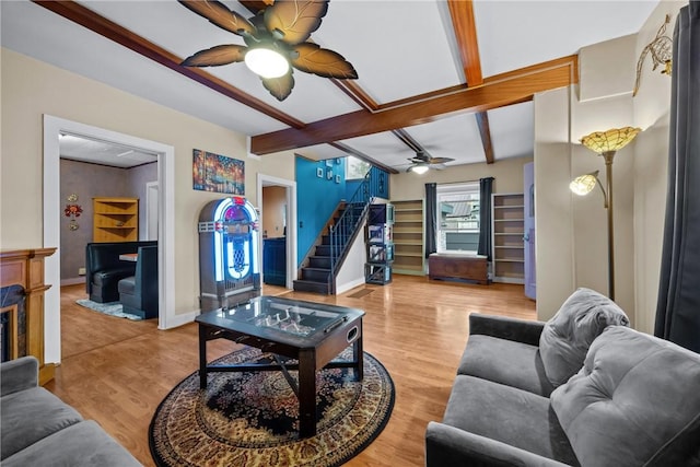 703 N Perry St, Dix, NY 14891 - living area with ceiling fan, beamed ceiling, stairway, and light wood-type flooring