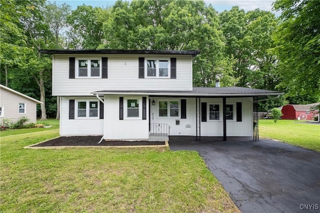 210 Sandra Ln, Clay, NY 13212 - traditional-style house with a front lawn, a porch, driveway, and a carport