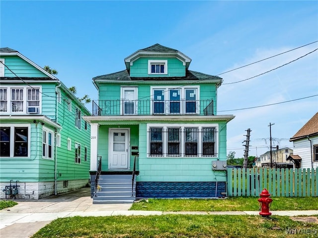210 Carl St, Buffalo, NY 14215 - american foursquare style home with a balcony and entry steps