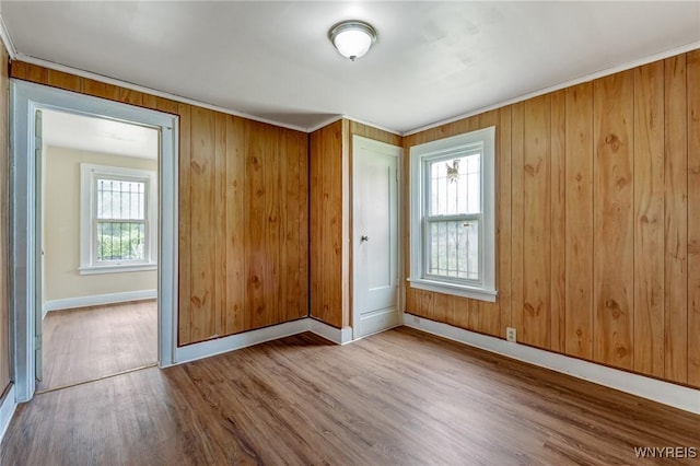 210 Carl St, Buffalo, NY 14215 - spare room with wood finished floors, plenty of natural light, wood walls, and ornamental molding