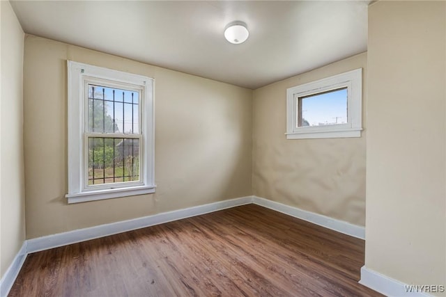 210 Carl St, Buffalo, NY 14215 - empty room with baseboards and wood finished floors