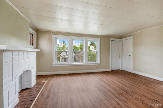 210 Carl St, Buffalo, NY 14215 - unfurnished living room featuring ornamental molding, wood finished floors, and a fireplace