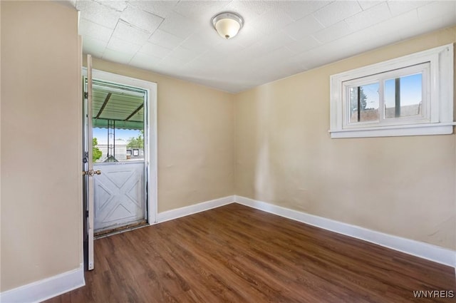 210 Carl St, Buffalo, NY 14215 - spare room featuring dark wood finished floors and baseboards
