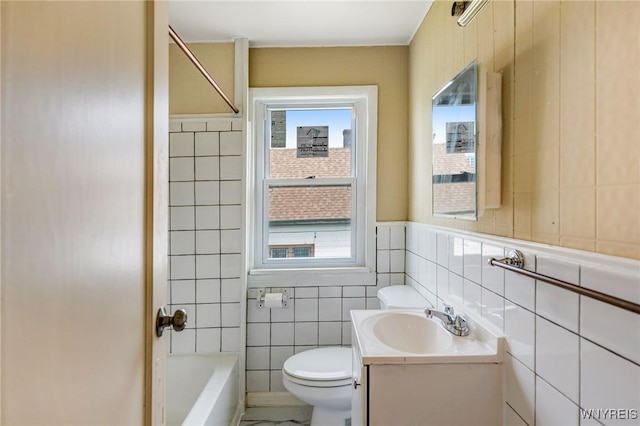 210 Carl St, Buffalo, NY 14215 - full bathroom featuring tile walls, vanity, and bathtub / shower combination