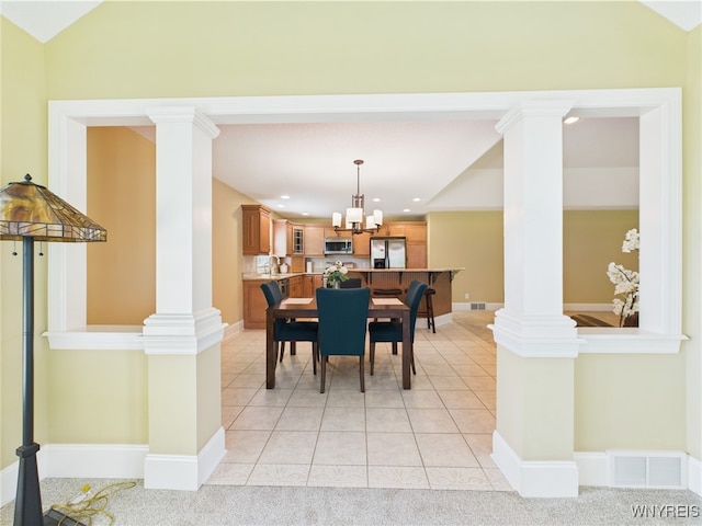 4166 Tisbury Ln, Hamburg, NY 14075 - dining space with decorative columns, recessed lighting, light tile patterned floors, and a chandelier