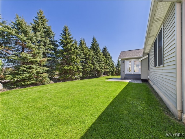 4166 Tisbury Ln, Hamburg, NY 14075 - view of grassy yard featuring french doors