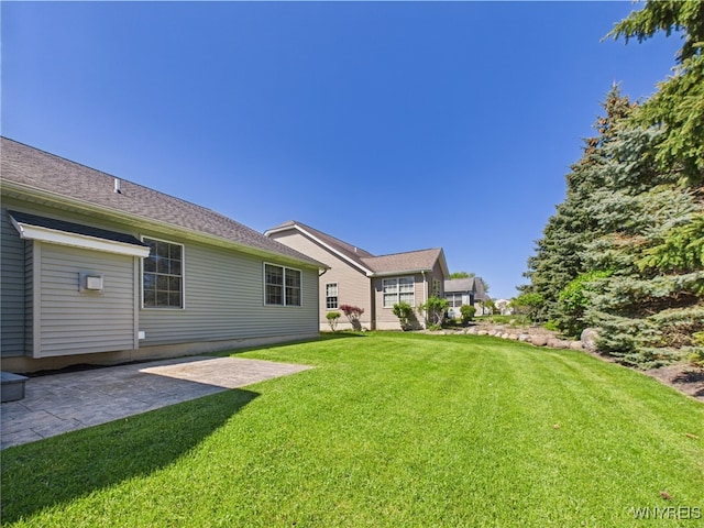 4166 Tisbury Ln, Hamburg, NY 14075 - view of grassy yard with a patio area