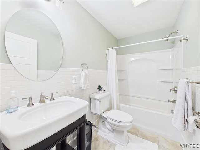4166 Tisbury Ln, Hamburg, NY 14075 - full bathroom with tile walls, shower / bath combo with shower curtain, vanity, a wainscoted wall, and tile patterned flooring