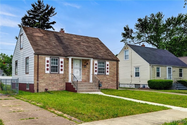 357 Hastings Ave, Buffalo, NY 14215 - new england style home featuring stone siding, a chimney, entry steps, and roof with shingles