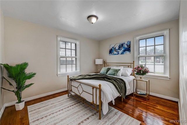 357 Hastings Ave, Buffalo, NY 14215 - bedroom featuring multiple windows and wood finished floors