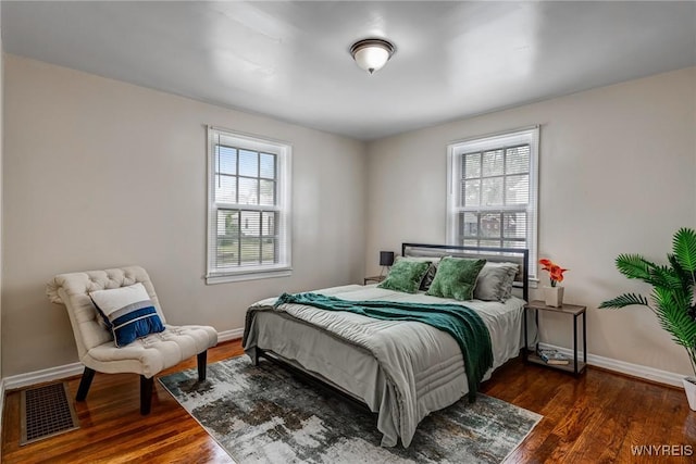 357 Hastings Ave, Buffalo, NY 14215 - bedroom featuring multiple windows and dark wood-style flooring