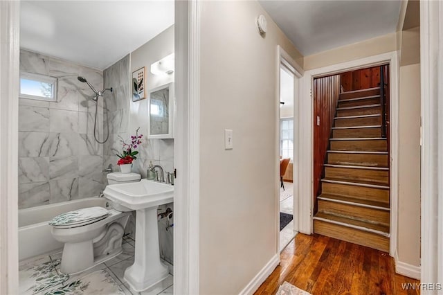 357 Hastings Ave, Buffalo, NY 14215 - bathroom featuring tub / shower combination and wood finished floors