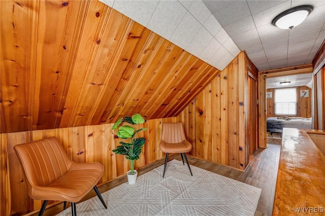 357 Hastings Ave, Buffalo, NY 14215 - living area with wood walls, wood finished floors, and lofted ceiling