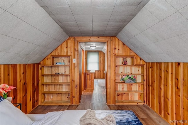 357 Hastings Ave, Buffalo, NY 14215 - additional living space featuring wooden walls, wood finished floors, and vaulted ceiling