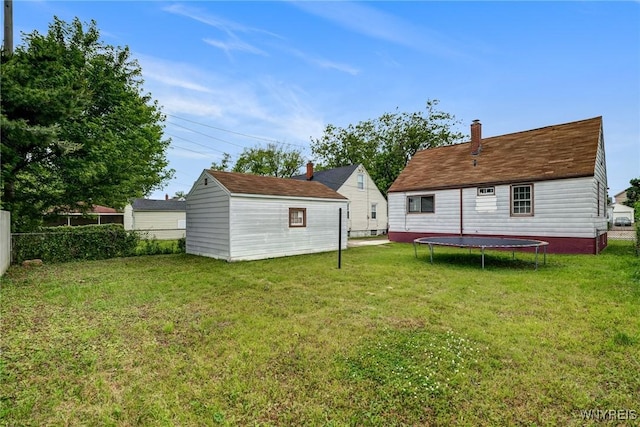 357 Hastings Ave, Buffalo, NY 14215 - rear view of house featuring a trampoline and an outdoor structure