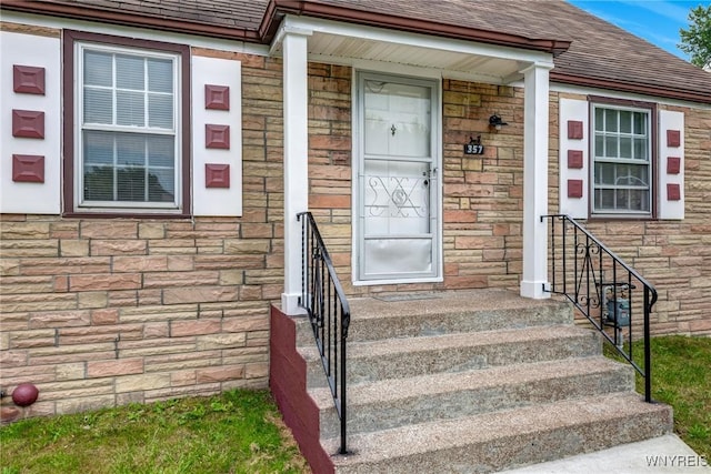 357 Hastings Ave, Buffalo, NY 14215 - property entrance featuring stone siding and a shingled roof