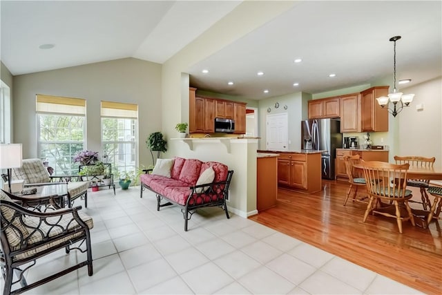 74 Chadwick Mnr, Perinton, NY 14450 - living room with a chandelier, light tile patterned floors, recessed lighting, and vaulted ceiling
