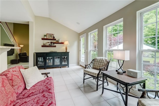 74 Chadwick Mnr, Perinton, NY 14450 - living room with plenty of natural light, lofted ceiling, and light tile patterned floors