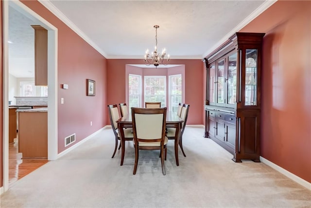 74 Chadwick Mnr, Perinton, NY 14450 - dining space with a chandelier, crown molding, and light carpet