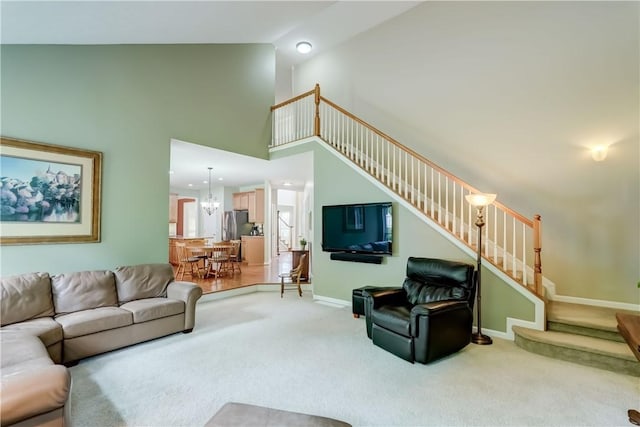 74 Chadwick Mnr, Perinton, NY 14450 - living area with stairs, light colored carpet, and high vaulted ceiling