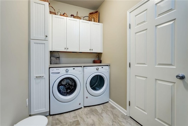 74 Chadwick Mnr, Perinton, NY 14450 - washroom featuring separate washer and dryer, light marble finish floors, and cabinet space
