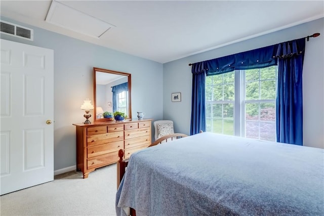 74 Chadwick Mnr, Perinton, NY 14450 - bedroom featuring attic access, multiple windows, and light carpet