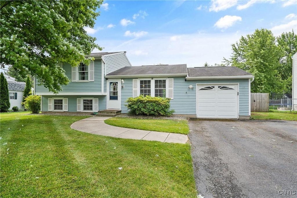8272 Mantova Dr, Clay, NY 13041 - tri-level home with a garage and asphalt driveway