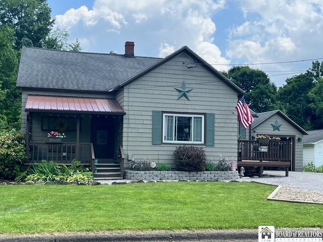 531 Fountain St, Olean-City, NY 14760 - view of front of house featuring a front yard, a porch, roof with shingles, and a chimney