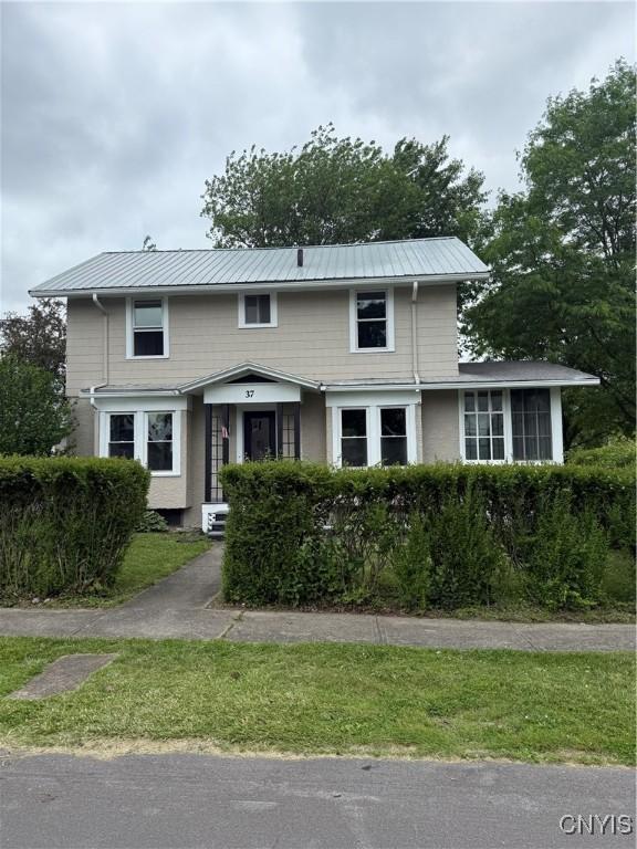 37 Peacock St, Auburn, NY 13021 - traditional-style home featuring a metal roof