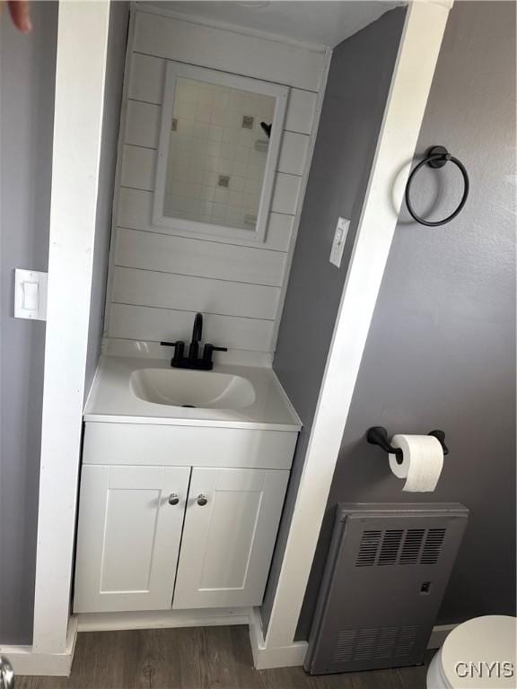 37 Peacock St, Auburn, NY 13021 - half bathroom featuring vanity and wood finished floors