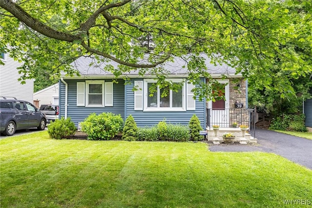 39 Marwood Rd, Greece, NY 14616 - bungalow-style house with a front yard and a shingled roof