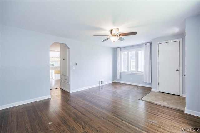 39 Marwood Rd, Greece, NY 14616 - spare room featuring plenty of natural light, ceiling fan, arched walkways, and dark wood-type flooring