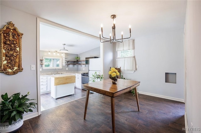 39 Marwood Rd, Greece, NY 14616 - dining area with a chandelier, dark wood-style flooring, and vaulted ceiling