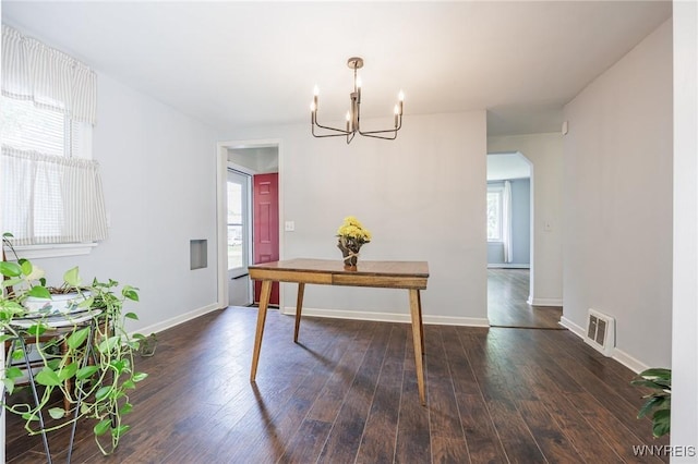 39 Marwood Rd, Greece, NY 14616 - dining space with a chandelier, dark wood-type flooring, and arched walkways
