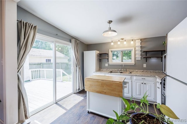 39 Marwood Rd, Greece, NY 14616 - kitchen featuring open shelves, freestanding refrigerator, healthy amount of natural light, and white cabinets