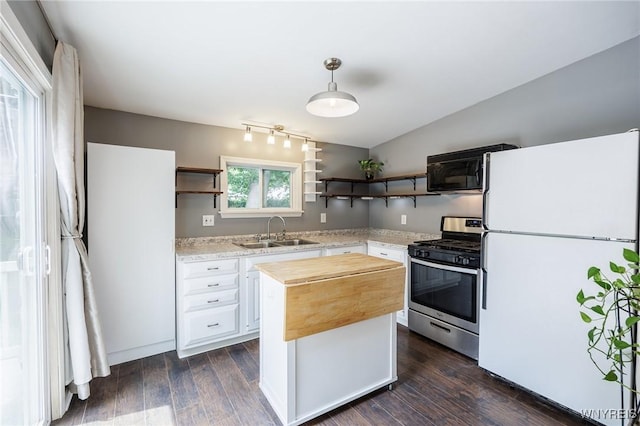 39 Marwood Rd, Greece, NY 14616 - kitchen with freestanding refrigerator, gas range, open shelves, black microwave, and dark wood finished floors