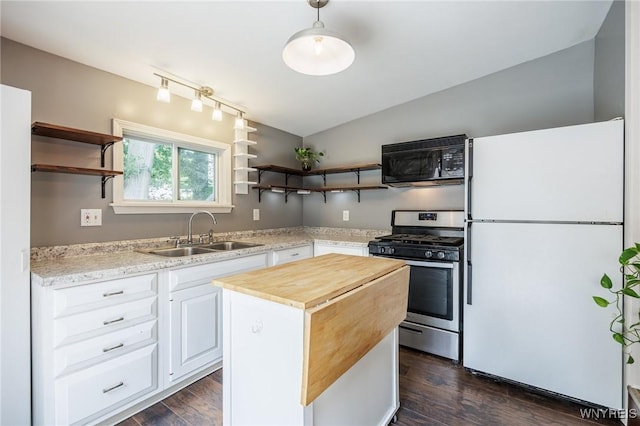 39 Marwood Rd, Greece, NY 14616 - kitchen featuring freestanding refrigerator, black microwave, stainless steel range with gas cooktop, open shelves, and wood counters