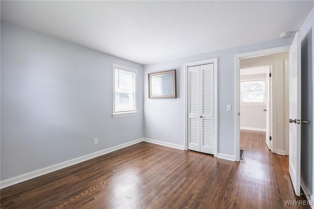 39 Marwood Rd, Greece, NY 14616 - unfurnished bedroom featuring dark wood finished floors and a closet
