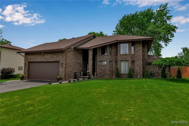 2160 Robert Dr, Niagara, NY 14304 - view of front of house featuring asphalt driveway, brick siding, a garage, and a shingled roof