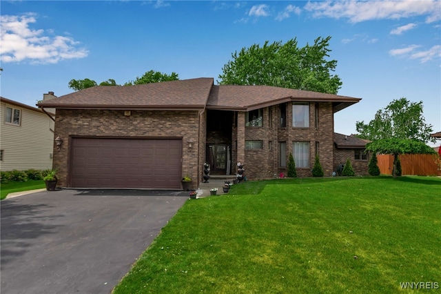 2160 Robert Dr, Niagara, NY 14304 - view of front facade with driveway, a front lawn, brick siding, a garage, and roof with shingles