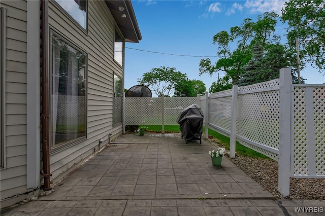 2160 Robert Dr, Niagara, NY 14304 - fenced backyard featuring a patio area and area for grilling