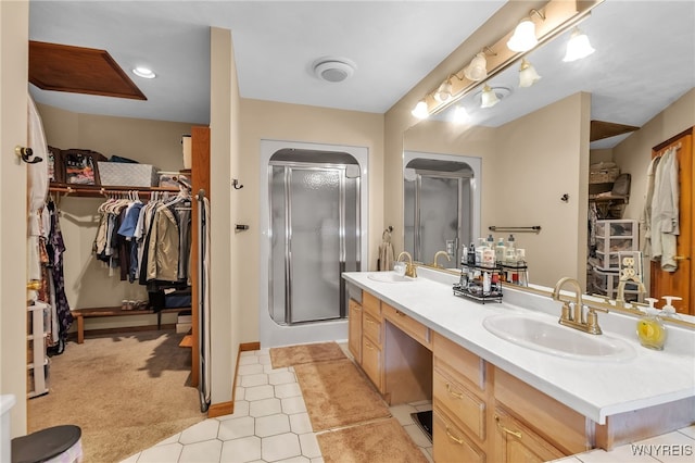2160 Robert Dr, Niagara, NY 14304 - full bath featuring a stall shower, double vanity, and a spacious closet