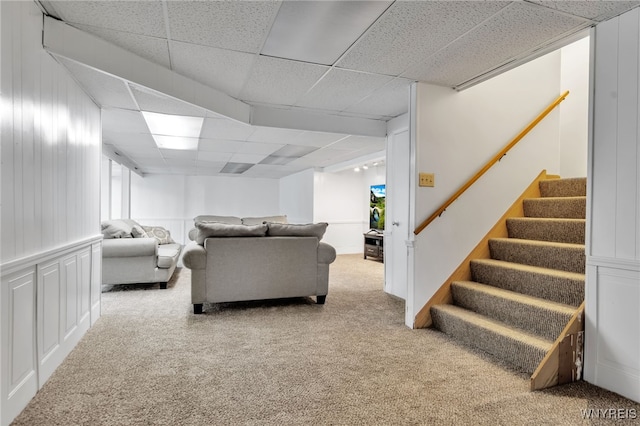 2160 Robert Dr, Niagara, NY 14304 - living room featuring a paneled ceiling, carpet floors, stairs, and healthy amount of natural light