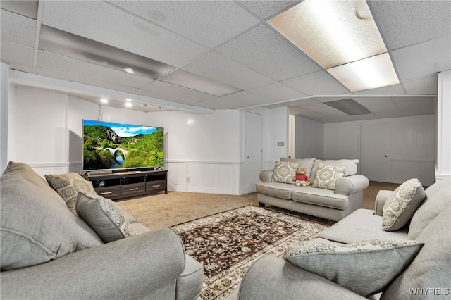2160 Robert Dr, Niagara, NY 14304 - carpeted living room featuring a decorative wall, a drop ceiling, and wainscoting