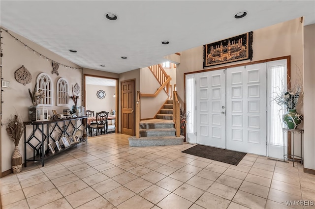 2160 Robert Dr, Niagara, NY 14304 - foyer entrance with light tile patterned floors, stairway, and recessed lighting