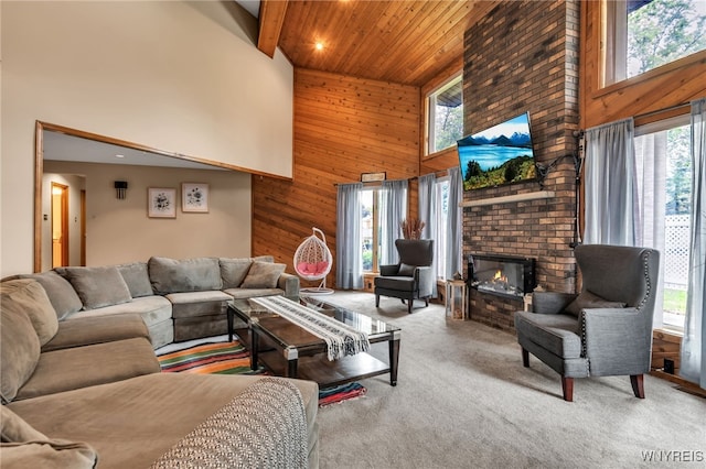 2160 Robert Dr, Niagara, NY 14304 - carpeted living area with a high ceiling, wooden walls, a brick fireplace, and wooden ceiling