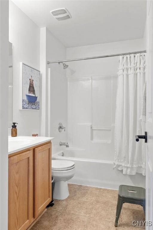 5418 Quamby Rd, Clay, NY 13041 - bathroom featuring vanity, shower / bath combo with shower curtain, and tile patterned flooring
