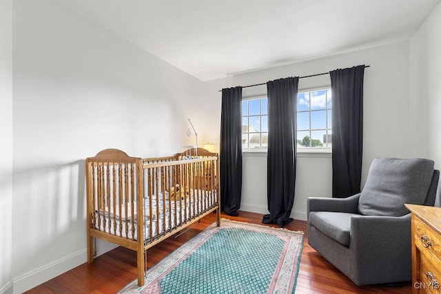5418 Quamby Rd, Clay, NY 13041 - bedroom with wood finished floors and a crib