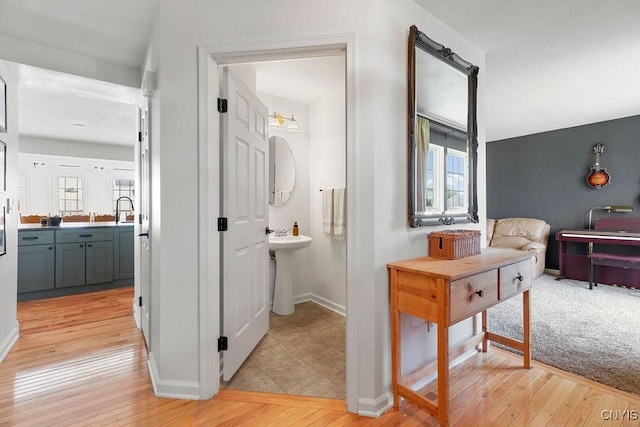 5418 Quamby Rd, Clay, NY 13041 - hallway featuring healthy amount of natural light and light wood-style floors